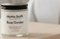 Body butter jar labeled 'Rose Garden' by 'mumu both' on a white background