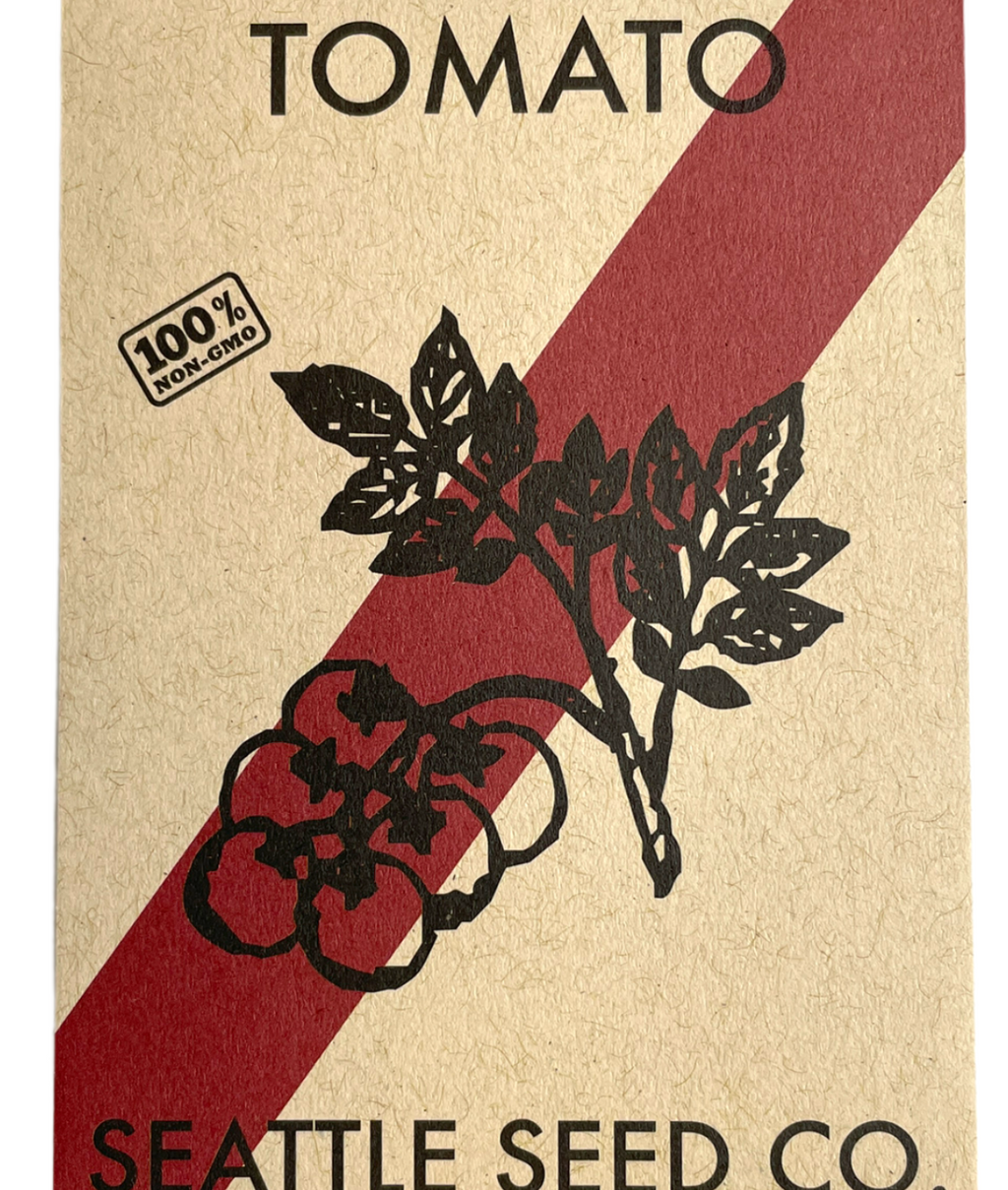 Seed packet for tomato seeds from Seattle Seed Co. with a red and white stripe design.
